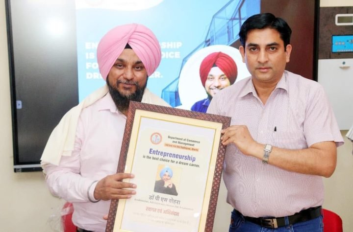 Receiving a citation from the Department of Commerce and Management after a talk on entrepreneurship